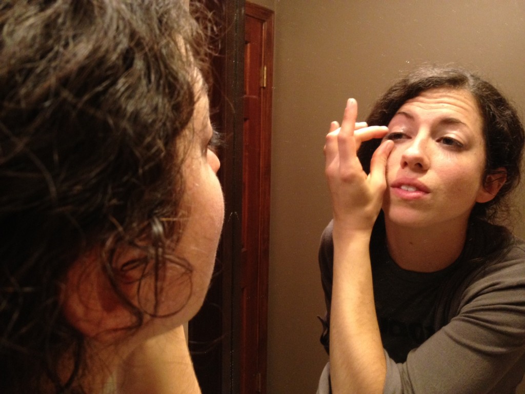 Applying coconut oil as a natural eye make-up remover Applying coconut oil as a natural eye make-up remover